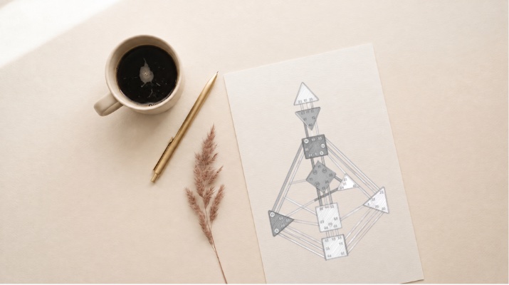 Ein ausgedrucktes Chart auf hellem Papier, daneben eine Tasse Kaffee und ein Stift
